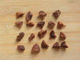 Brown color roasted broken Areca nuts