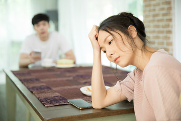 Young wife feels depressed because of unhappy relationship with husband