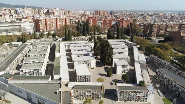 Aerial view of cemetery in the city. Drone Footage