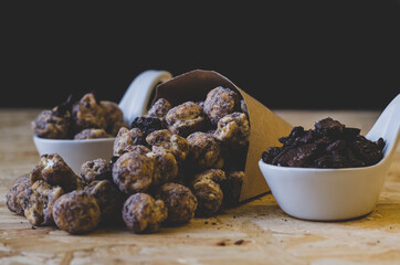 popcorn and chocolate in black background