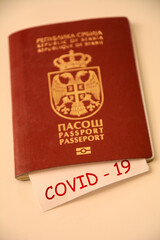 Coronavirus concept background. Passport and note on wooden table