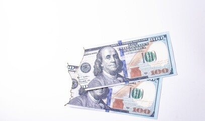 Burnt dollars. Burnt side view on white background banknotes in close-up