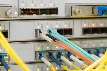 Modern cable internet connection. There are high speed central router interfaces in the server room. Fiber optic data transmission wires.