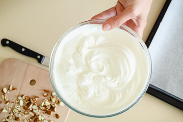 Mixing bowl with whipped meringue and devices for cooking and baking
