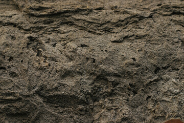 Concrete destroyed wall. Surface with large cracks. The texture of the cement. Concrete background.