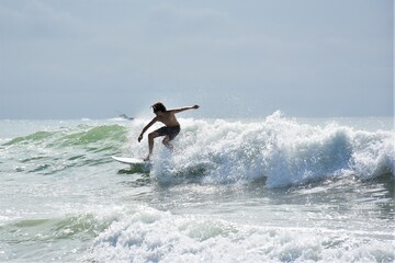 Surfer Surfing Waves