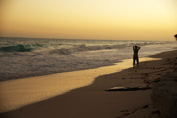 Fototapeta na wymiar at sunset on a caribbean beach in summer