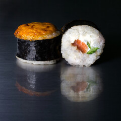 Seaweed and rice rolls with salmon, cucumber and cream cheese