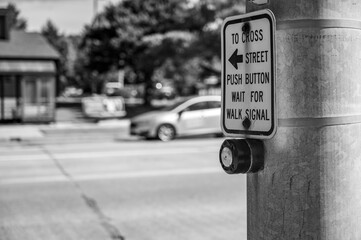 Push button at cross walk busy street intersection in a city