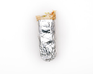 Bitten Durum kebab in foil paper