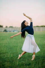 Japanese ballerina dances on lawn background.