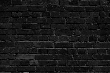 Black brick wall. Loft interior design. Black paint of the facade.