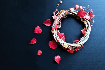 Autumn background with vibrant fall leaves on black, a design template with a place for text