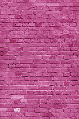 Pink brick wall. Loft interior design. Pink paint of the facade. Architectural background.