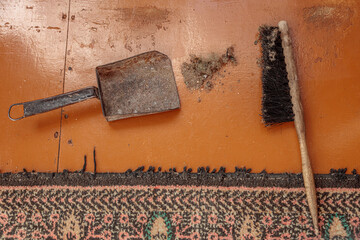 Vintage scoop and a duster with garbage. still life, from the top