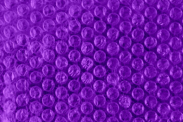Naklejka na ściany i meble Purple color plastic bubble packing material, close-up