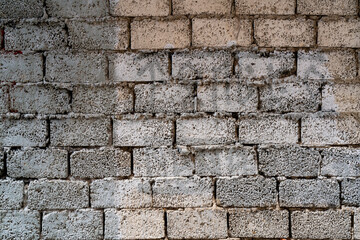 Gray brick wall. Loft interior design. Gray paint of the facade.