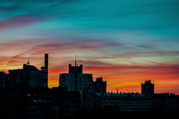 Fototapeta na wymiar Bright colorful sunset in the urban landscape.