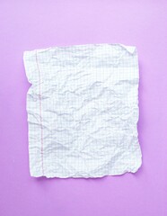 A crumpled sheet of white paper in a cage on a purple background.