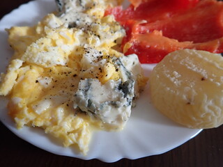 fresh hot scrambled eggs with vegetables