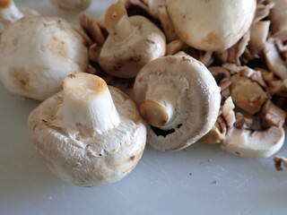 champignons on a white cutting board