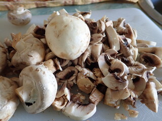 champignons on a white cutting board