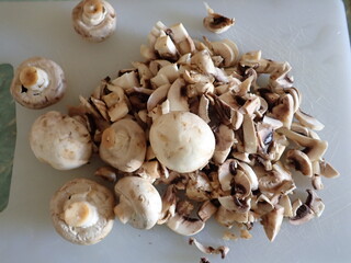 champignons on a white cutting board
