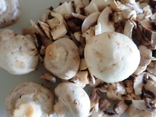 champignons on a white cutting board