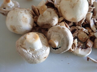 champignons on a white cutting board