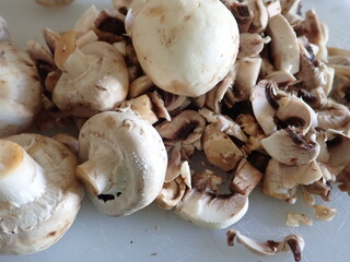 champignons on a white cutting board