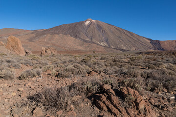 Martian landscape on the eastern slopes of Montana Blanca Mirador las Minas de San Jose with Teide mount at background. Teide National park, Tenerife, Canary islands, Spain