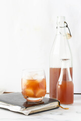 Homemade iced lemonade with ripe peaches. Fresh peach ice tea in a mason jar.