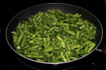 green beans cooking in a pan