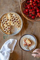 Homemade sweet cherry pie on a rustic background.