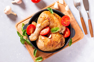 Chicken Legs with garlic on bright gray background. Top view.