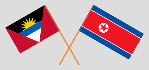 Crossed flags of Antigua and Barbuda and North Korea