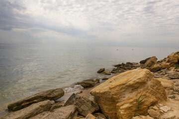 Wild stone rocky summer seaside with grey stormy sky calm moment nature journey peaceful mind concept