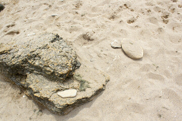 Stones composition on summer sandy sea beach travel meditation relax zen concept 