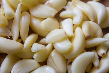 View of broken down garlic pieces. Garlic helps build immunity against cold and flu.