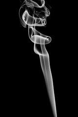 Real smoke on a dark background. Abstract wallpaper with color overlay. Mystical smoke. Isolated strict background. Semi-transparent smoke with smooth transitions of color. Magic forms
