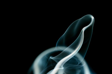Real smoke on a dark background. Abstract wallpaper with color overlay. Mystical smoke. Isolated...