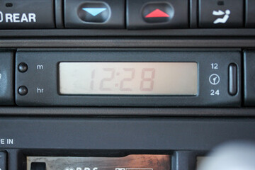Old car dashboard with clock