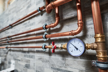 Fototapeta premium Plumbing service. copper pipeline of a heating system in boiler room
