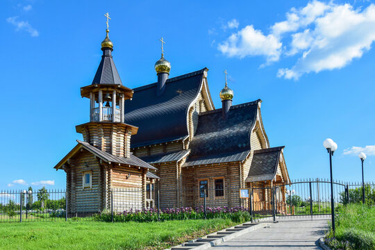 Photo of a wooden Orthodox Church with Golden domes
