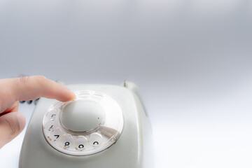 Dialing a number on a rotary telephone