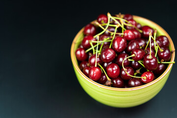 Ripe cherries are in the bowlRipe cherries are in the bowl