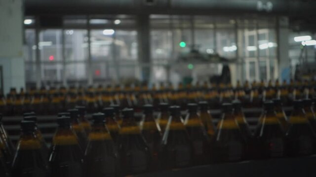 Beer Bottles On The Conveyor Belt. Selective Focus.