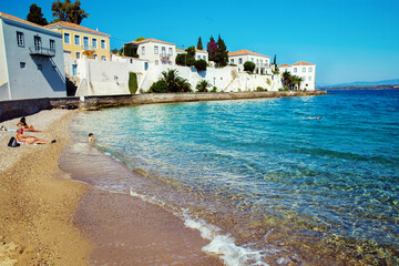 Awe greek island - Spetses  - people on the beach   (on far distance )
