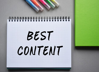 Motivational inspirational business words, quotes lettering, typography. Conceptual image. Top view on a notebook and office supplies that lie on a table, on a dark background. Marketing.