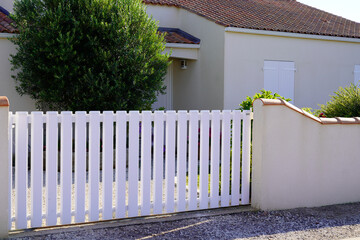 modern white gate pvc plastic portal with blades of suburbs house